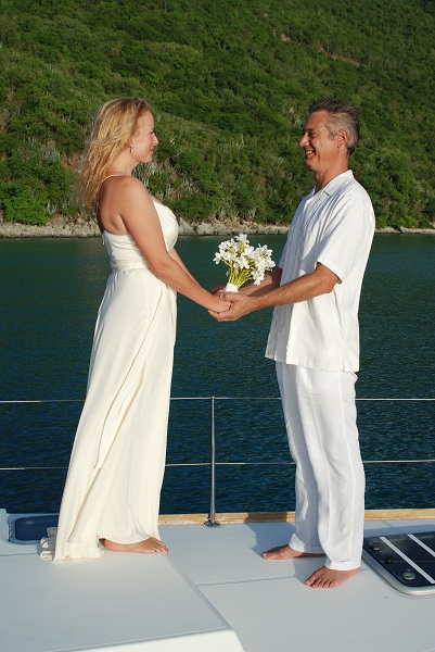 Happy couple getting married on a Epic Yacht Charter in the BVI.