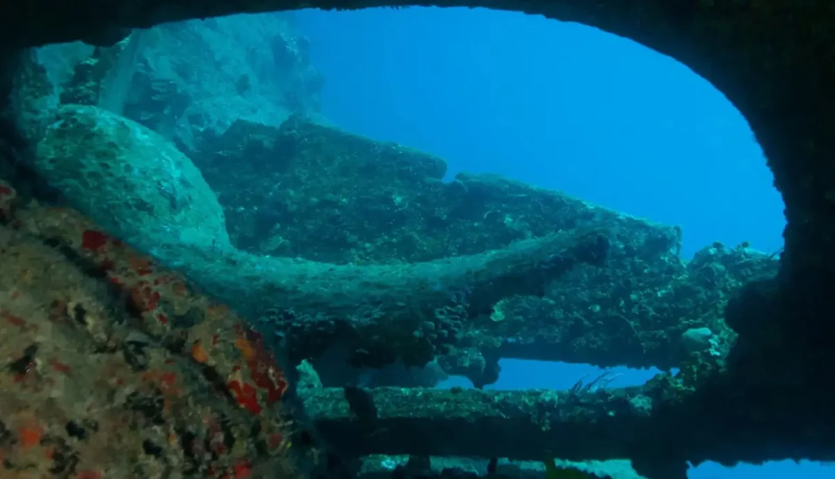 RMS Rhone propeller with diver silhouette at Salt Island British Virgin Islands premier wreck diving site