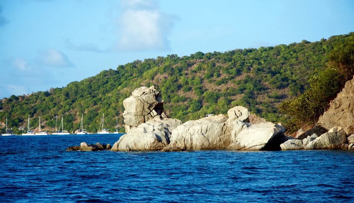 Manhead Point distinctive rock formation on Salt Island British Virgin Islands with yacht anchorage