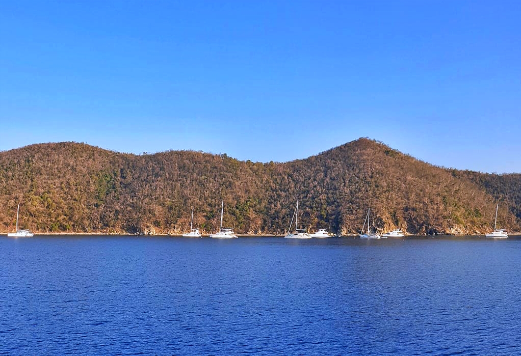 Great Harbour on Peter Island showing protected anchorage with mountains and Sir Francis Drake Channel in the British Virgin Islands