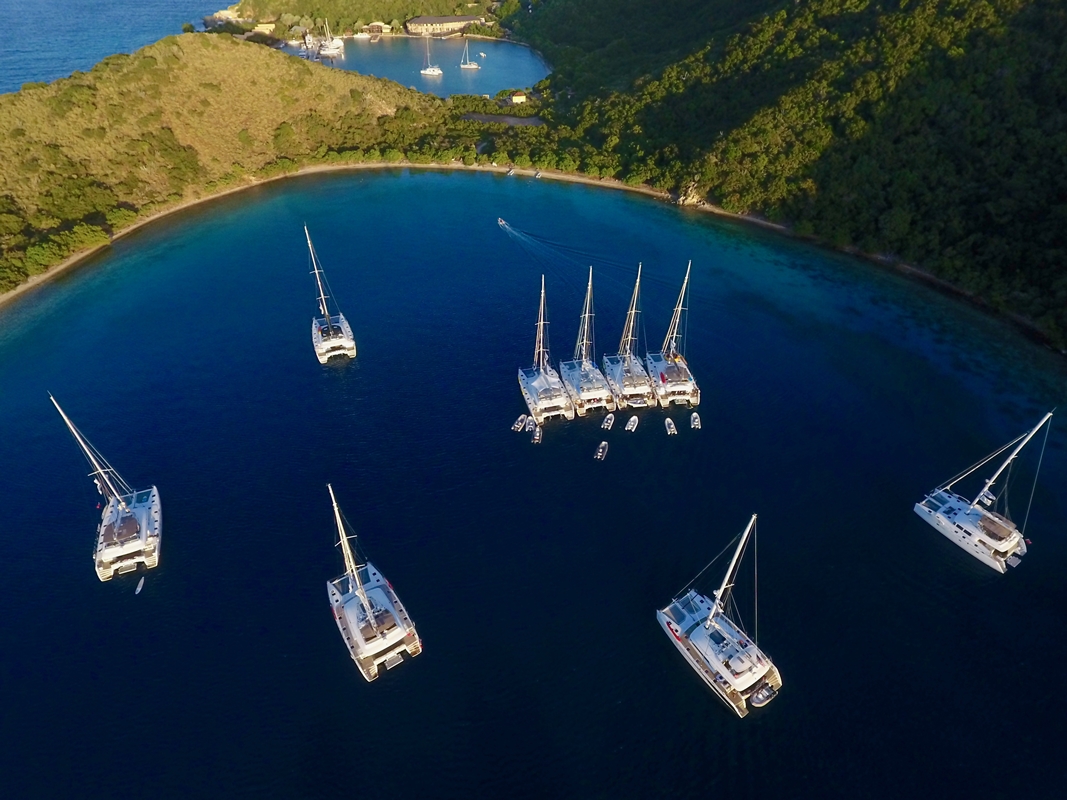 Crewed charter yachts rafting together in Great Harbour, Peter Island, British Virgin Islands