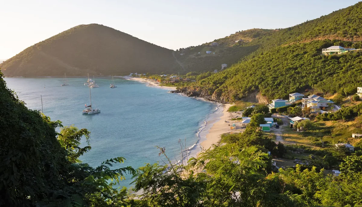 Aerial overview of White Bay, Jost Van Dyke, British Virgin Islands with charter yachts anchored in the bay