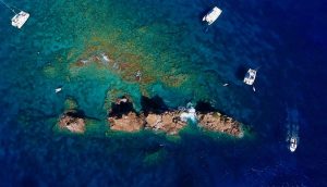 Aerial view of the Indians dive site off Norman Island in the British Virgin Islands with charter yachts on mooring balls